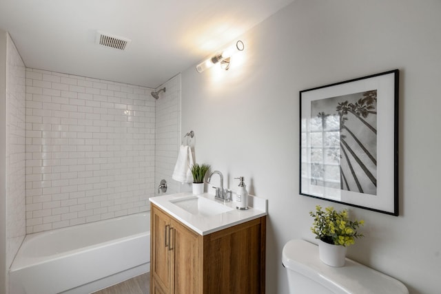 full bath with shower / bathtub combination, toilet, visible vents, and vanity