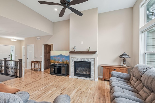 3623 Cove Point Cir NW, Prior Lake, MN 55372 - living area featuring light wood-type flooring, a ceiling fan, a glass covered fireplace, and recessed lighting