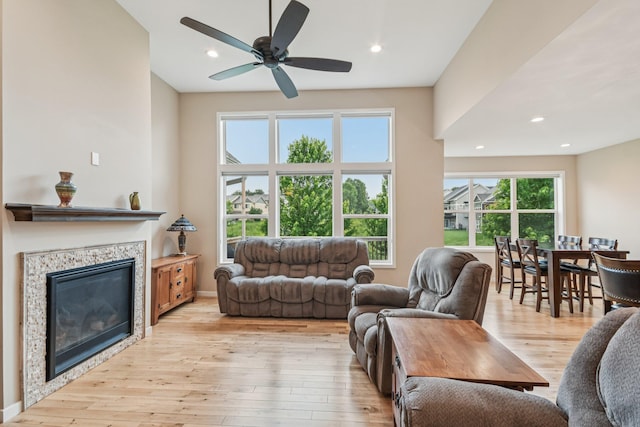 3623 Cove Point Cir NW, Prior Lake, MN 55372 - living area with light wood-style floors, recessed lighting, a ceiling fan, and a glass covered fireplace