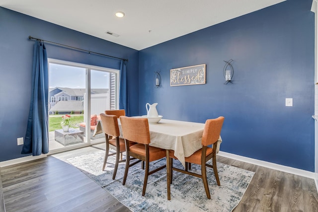 dining space with wood finished floors, visible vents, baseboards, and recessed lighting