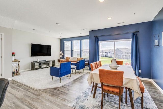 dining room with visible vents, wood finished floors, baseboards, and recessed lighting