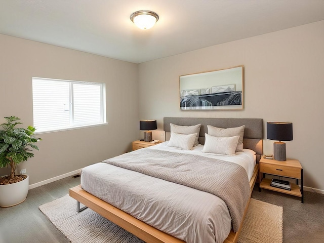 bedroom featuring carpet floors and baseboards