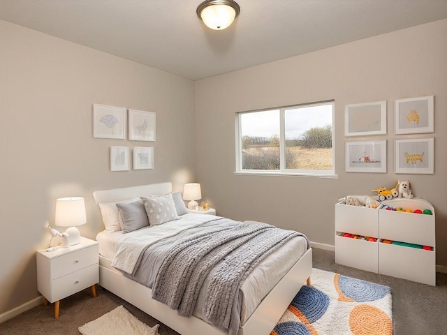 bedroom featuring carpet floors and baseboards