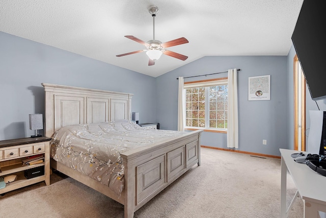 bedroom featuring baseboards, ceiling fan, lofted ceiling, and light carpet