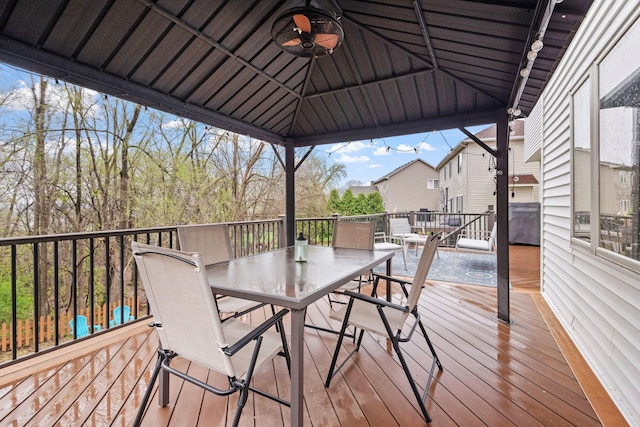 deck with a ceiling fan and outdoor dining area