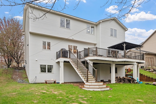 rear view of property featuring stairs, a wooden deck, and a yard