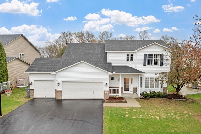 traditional-style house featuring aphalt driveway, a front yard, brick siding, a shingled roof, and an attached garage