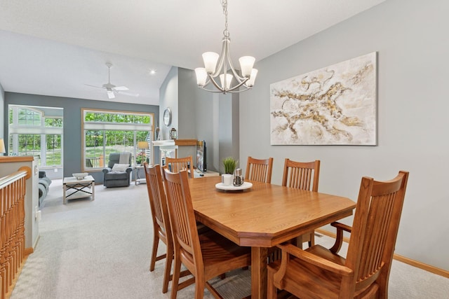 dining room with light colored carpet, a chandelier, ceiling fan, baseboards, and recessed lighting