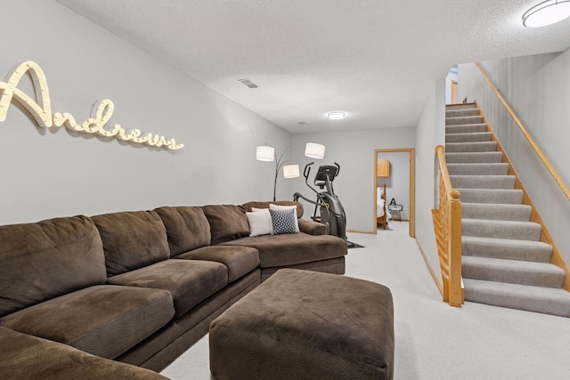 living room with stairway, light colored carpet, and a textured ceiling