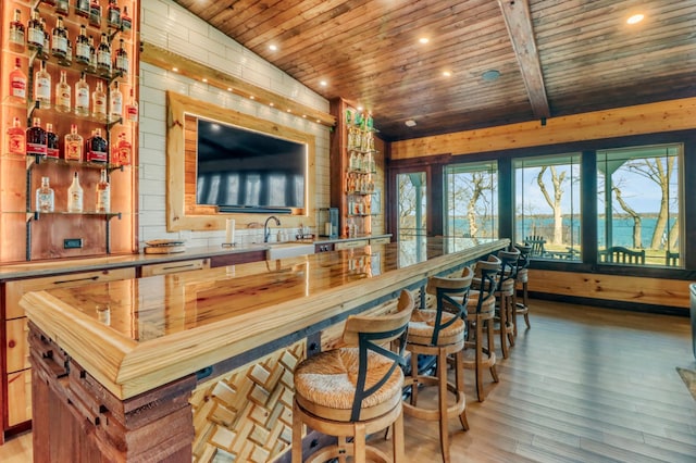 23351 County Highway 22, Lake View Twp, MN 56501 - bar featuring a sink, wooden ceiling, light wood-style flooring, and wet bar