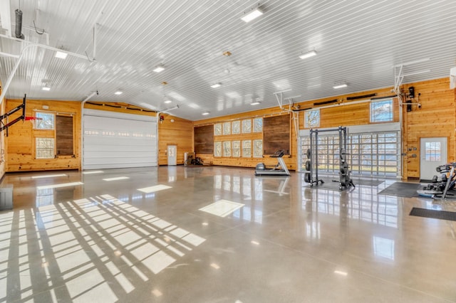 23351 County Highway 22, Lake View Twp, MN 56501 - misc room with wooden walls, vaulted ceiling, and finished concrete floors