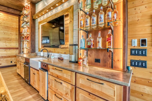 23351 County Highway 22, Lake View Twp, MN 56501 - bar with wooden walls, bar, wooden ceiling, a sink, and light wood-style flooring