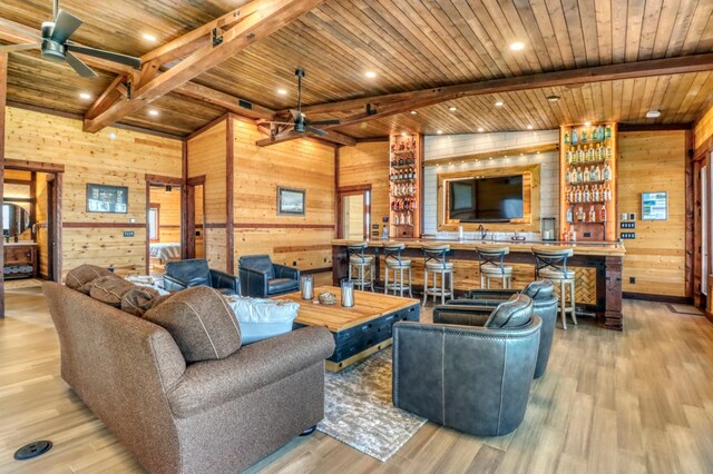 23351 County Highway 22, Lake View Twp, MN 56501 - living area featuring wooden walls, wooden ceiling, beamed ceiling, and a ceiling fan