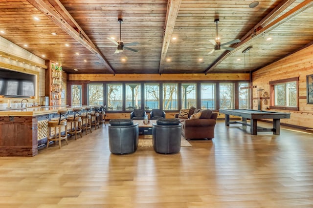 23351 County Highway 22, Lake View Twp, MN 56501 - playroom featuring wood walls, vaulted ceiling with beams, wooden ceiling, a ceiling fan, and light wood finished floors