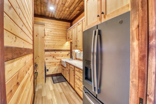 23351 County Highway 22, Lake View Twp, MN 56501 - kitchen with wooden walls, a sink, light wood-type flooring, stainless steel refrigerator with ice dispenser, and wood ceiling