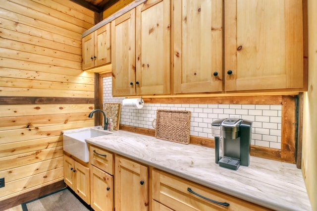 23351 County Highway 22, Lake View Twp, MN 56501 - clothes washing area featuring a sink, wood walls, and cabinet space