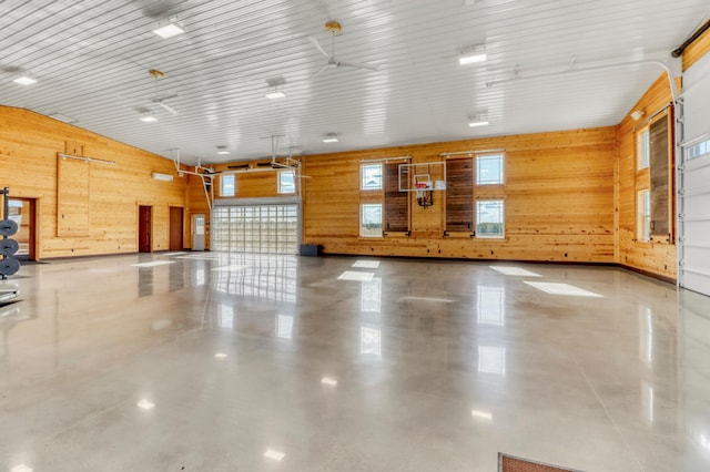 23351 County Highway 22, Lake View Twp, MN 56501 - miscellaneous room featuring a garage, wood walls, and concrete floors
