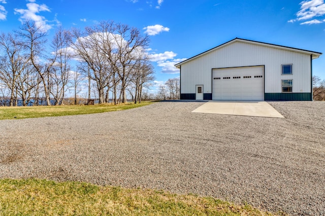23351 County Highway 22, Lake View Twp, MN 56501 - view of side of home with a detached garage and an outbuilding