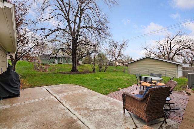 view of patio / terrace with a fenced backyard, outdoor dining space, and central AC