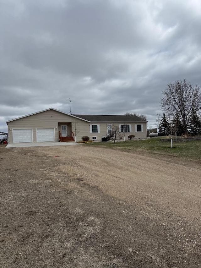 view of front of home featuring an attached garage and driveway