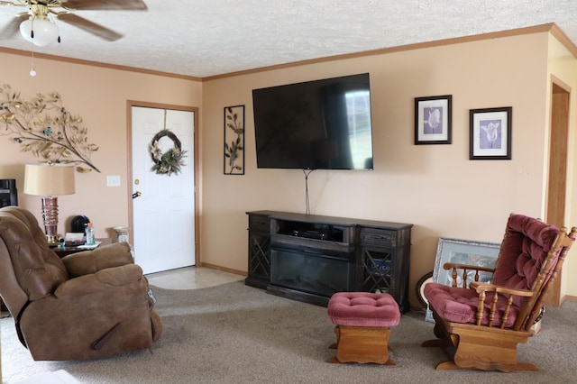 carpeted living room with ornamental molding, a textured ceiling, and ceiling fan