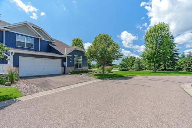 428 Hickory Ln N, Oakdale, MN 55128 - view of front facade featuring asphalt driveway and roof with shingles