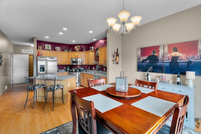 428 Hickory Ln N, Oakdale, MN 55128 - dining room with light wood-style flooring, a chandelier, and recessed lighting