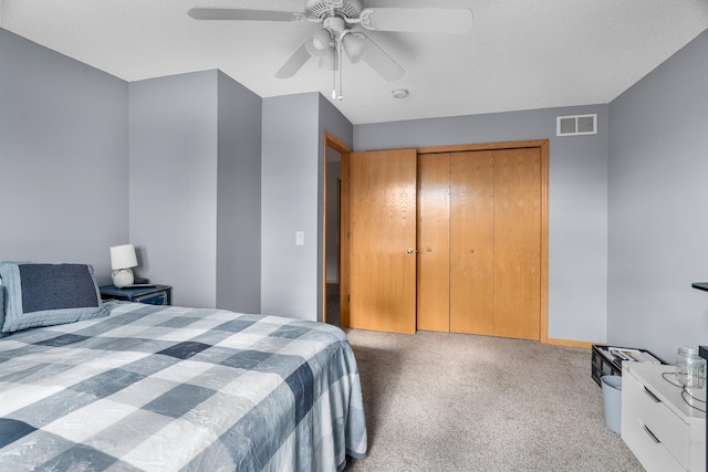 428 Hickory Ln N, Oakdale, MN 55128 - bedroom featuring carpet floors, a closet, and a ceiling fan