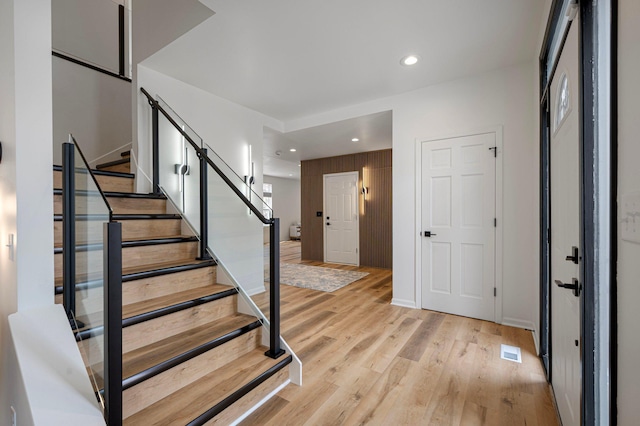 entrance foyer with visible vents, recessed lighting, light wood finished floors, and stairs