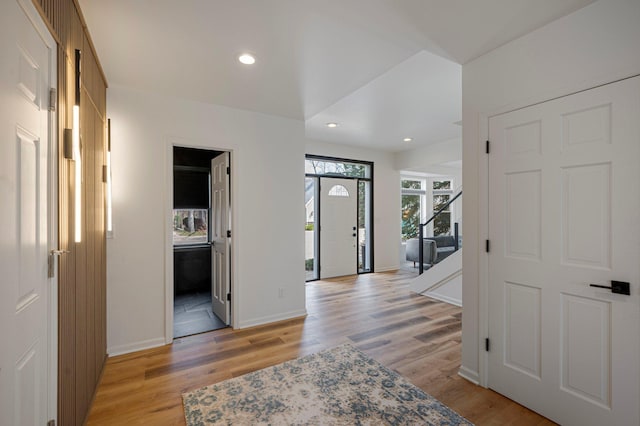 foyer entrance featuring recessed lighting, baseboards, and light wood finished floors