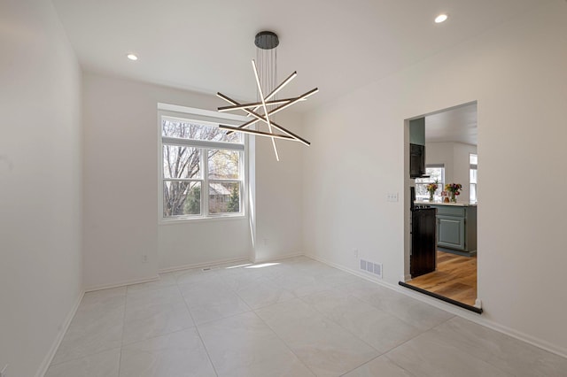 unfurnished room with an inviting chandelier, recessed lighting, baseboards, light tile patterned floors, and visible vents
