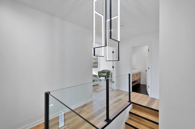 interior space with baseboards and wood finished floors