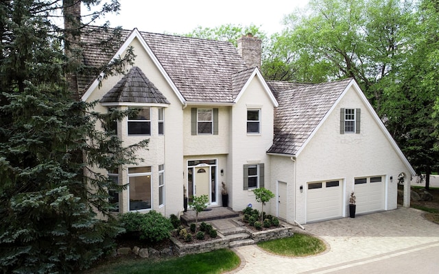 18740 11th Ave N, Plymouth, MN 55447 - view of front of property featuring a chimney and decorative driveway