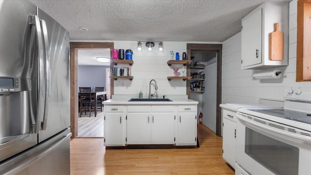 kitchen featuring stainless steel refrigerator with ice dispenser, white electric range oven, a sink, open shelves, and light countertops