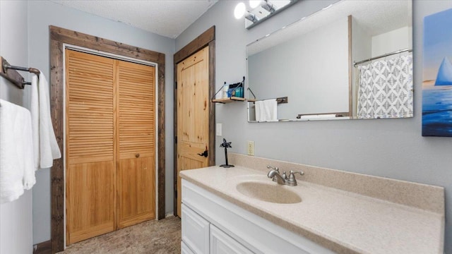 bathroom featuring vanity and a closet