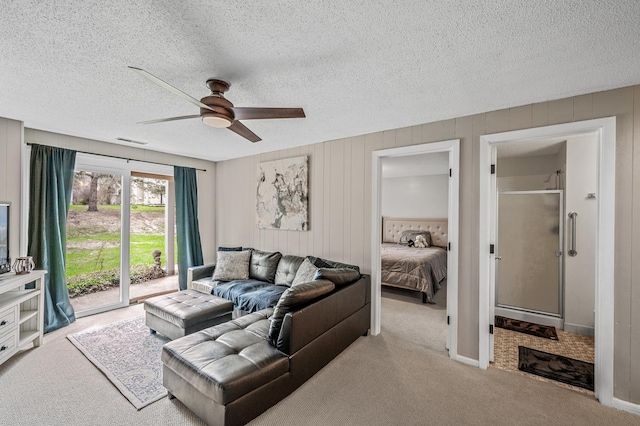 3903 Gershwin Ave N, Oakdale, MN 55128 - living room with visible vents, carpet flooring, a textured ceiling, and a ceiling fan