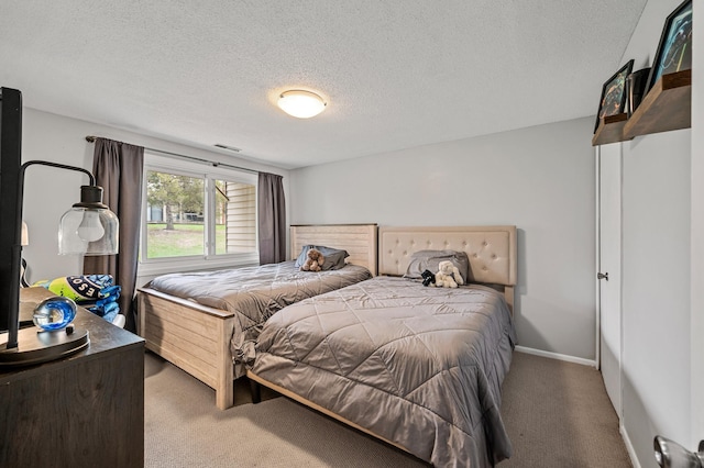 3903 Gershwin Ave N, Oakdale, MN 55128 - bedroom with carpet floors, a textured ceiling, baseboards, and visible vents