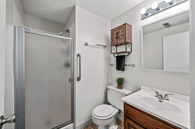 3903 Gershwin Ave N, Oakdale, MN 55128 - full bathroom featuring vanity, a shower stall, toilet, and a textured ceiling
