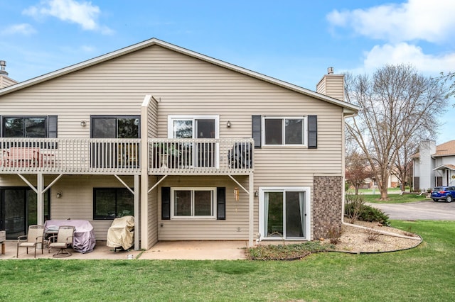 3903 Gershwin Ave N, Oakdale, MN 55128 - rear view of property with a lawn, a patio area, and a chimney