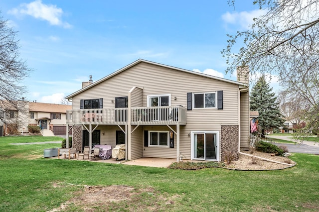 3903 Gershwin Ave N, Oakdale, MN 55128 - rear view of property with a yard, a patio, and a chimney