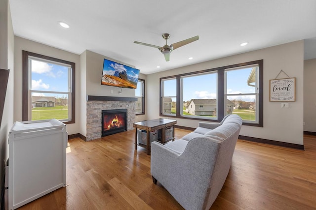 2120 Violet Ln, Faribault, MN 55021 - living area featuring baseboards, plenty of natural light, and a fireplace