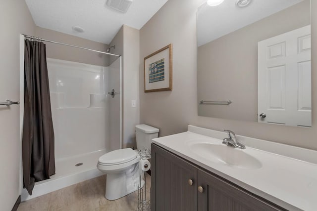 2120 Violet Ln, Faribault, MN 55021 - full bathroom with vanity, a stall shower, toilet, and visible vents