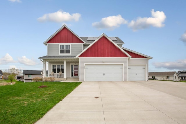 2120 Violet Ln, Faribault, MN 55021 - craftsman inspired home with board and batten siding, a front yard, solar panels, covered porch, and driveway