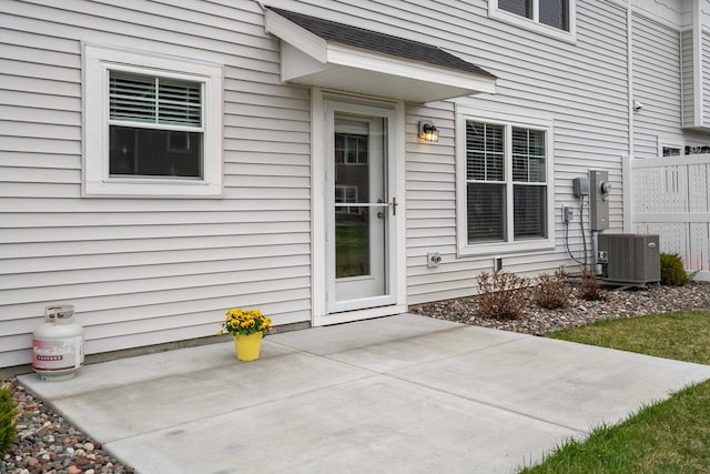 2166 Island Ct, Lino Lakes, MN 55038 - entrance to property with cooling unit, a patio, and fence