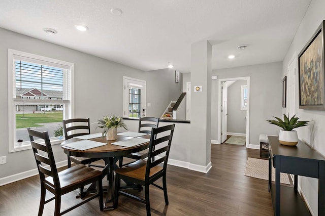2166 Island Ct, Lino Lakes, MN 55038 - dining area featuring plenty of natural light, baseboards, dark wood-type flooring, stairs, and recessed lighting