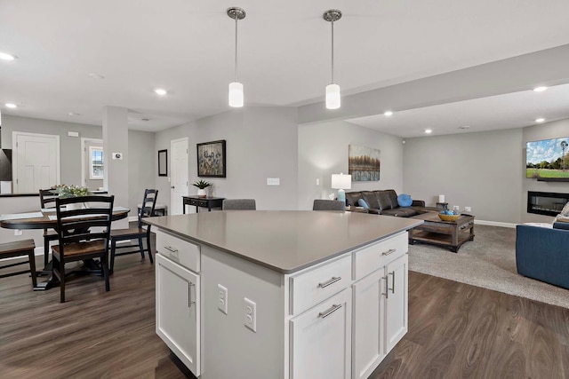 2166 Island Ct, Lino Lakes, MN 55038 - kitchen featuring open floor plan, a center island, dark wood-style floors, recessed lighting, and white cabinetry