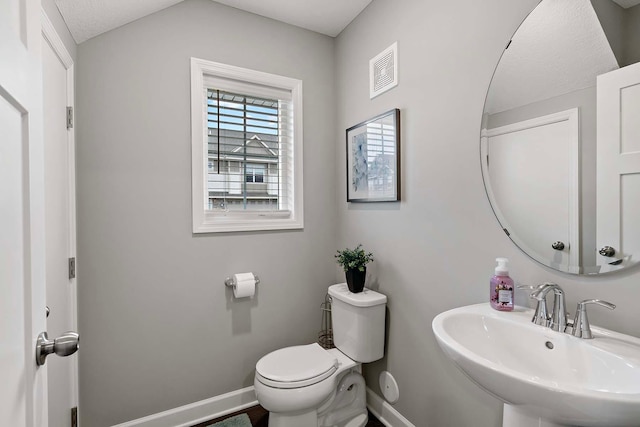 2166 Island Ct, Lino Lakes, MN 55038 - bathroom featuring a sink, baseboards, and toilet