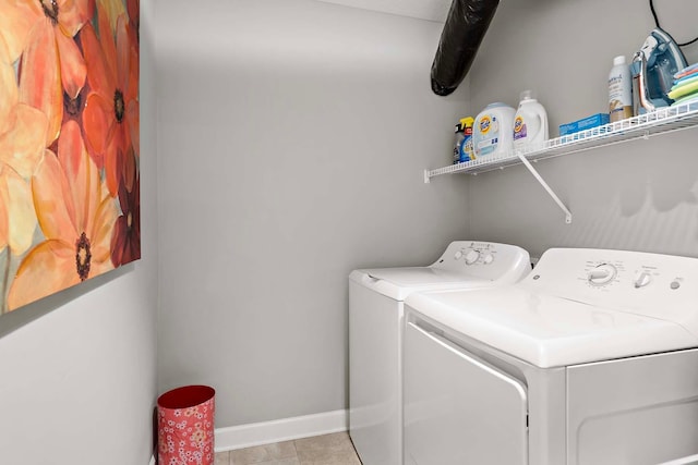 2166 Island Ct, Lino Lakes, MN 55038 - laundry area with independent washer and dryer, baseboards, and light tile patterned floors