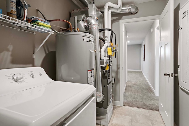 2166 Island Ct, Lino Lakes, MN 55038 - laundry room with washer / dryer, light carpet, baseboards, and light tile patterned floors
