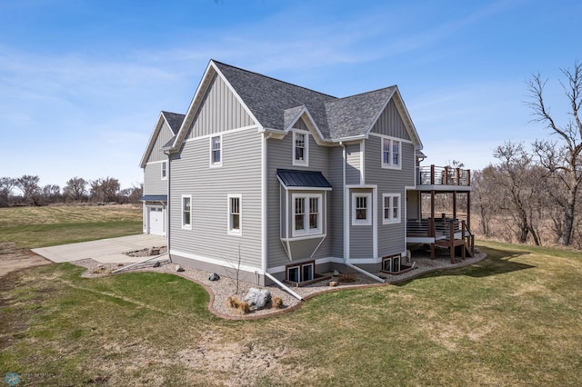 view of property exterior featuring board and batten siding, concrete driveway, a shingled roof, and a lawn